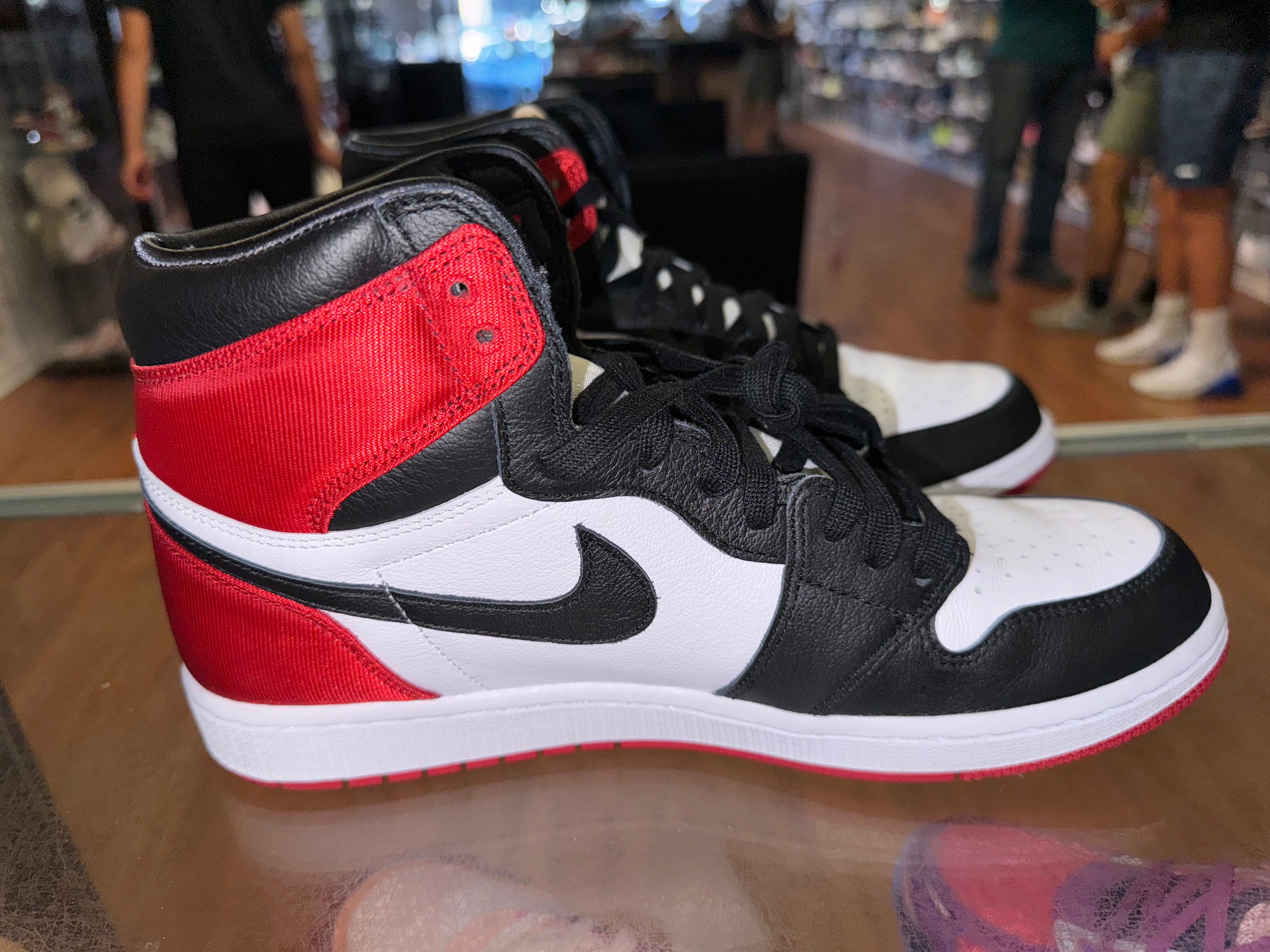 Size 9.5 (11W) Air Jordan 1 “Satin Black Toe”