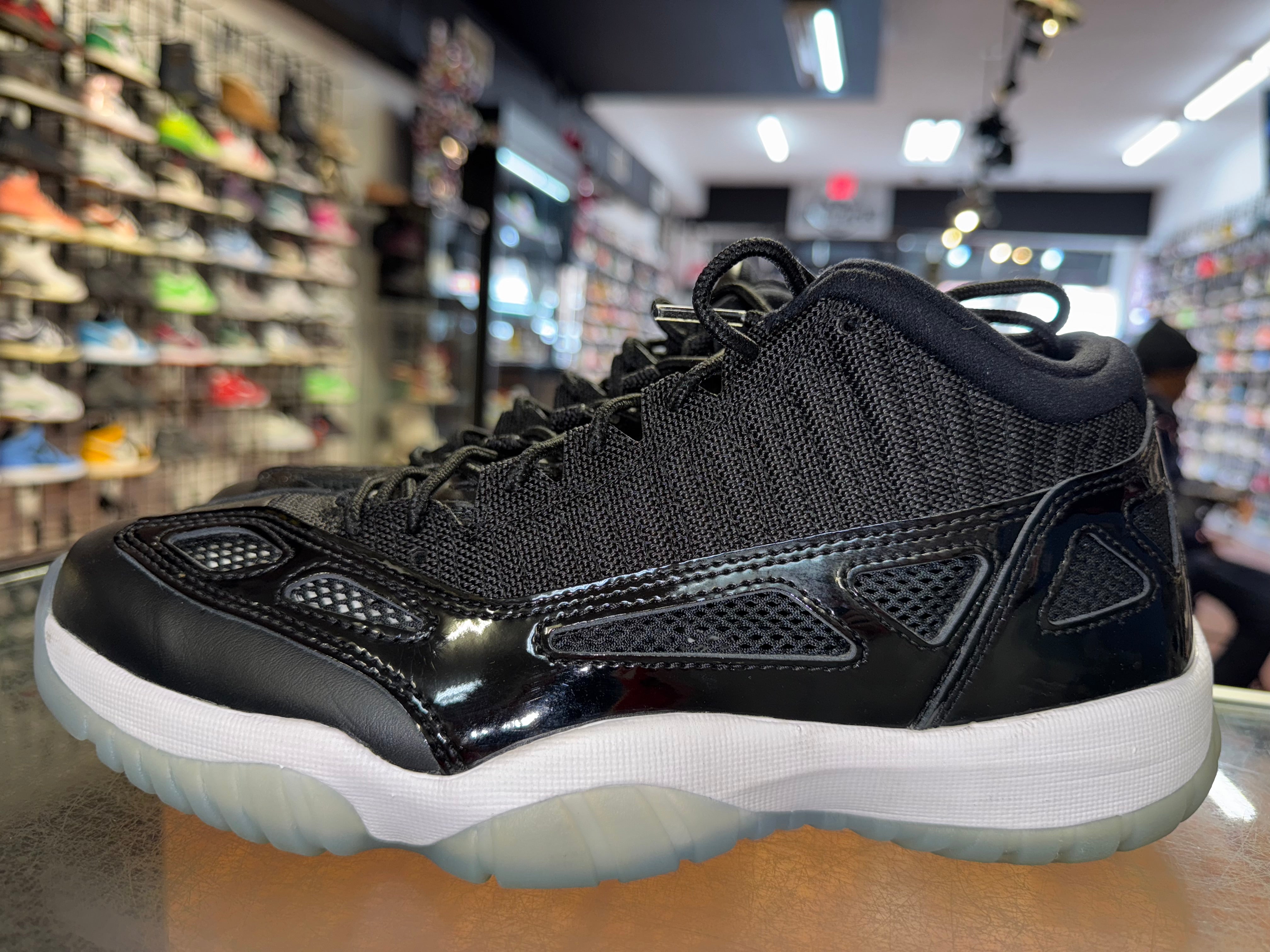 Size 9.5 Air Jordan 11 Low IE "Space Jam"