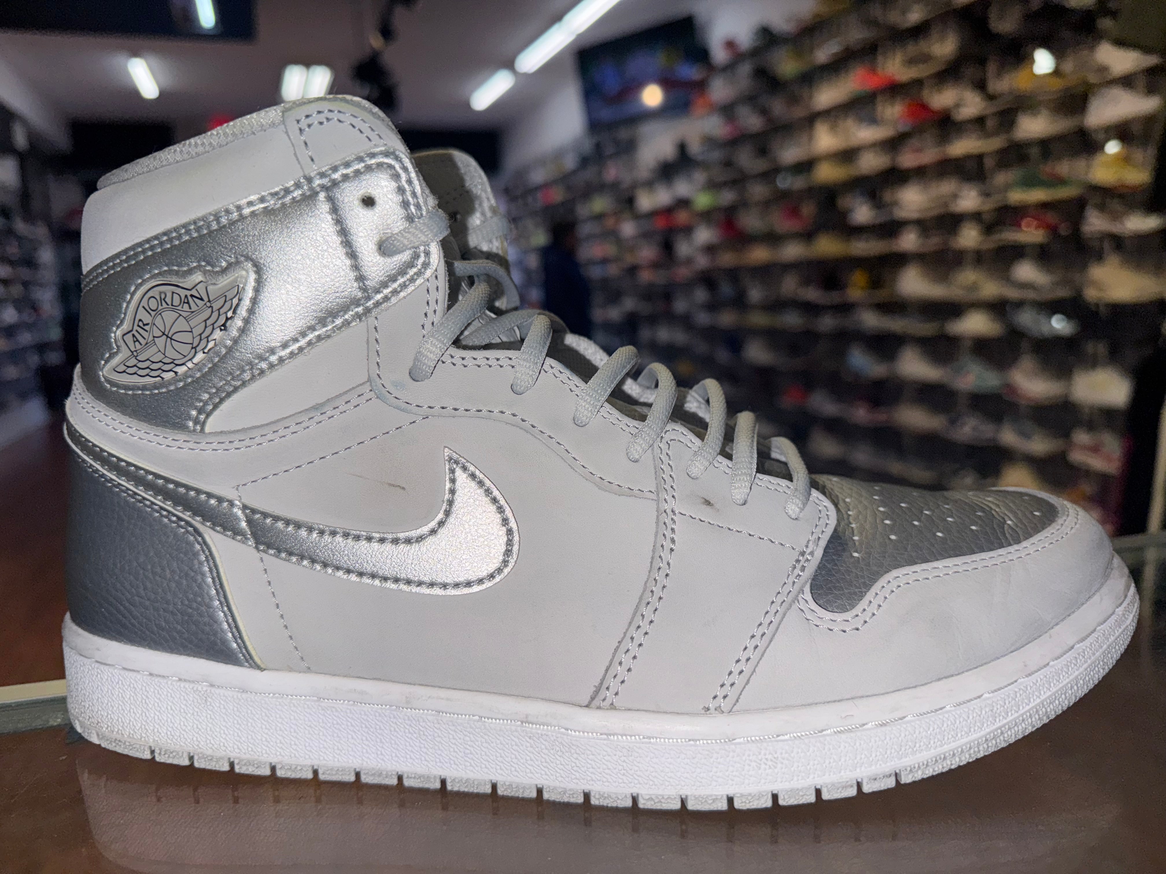 Size 11.5 Air Jordan 1 “COJP Silver”