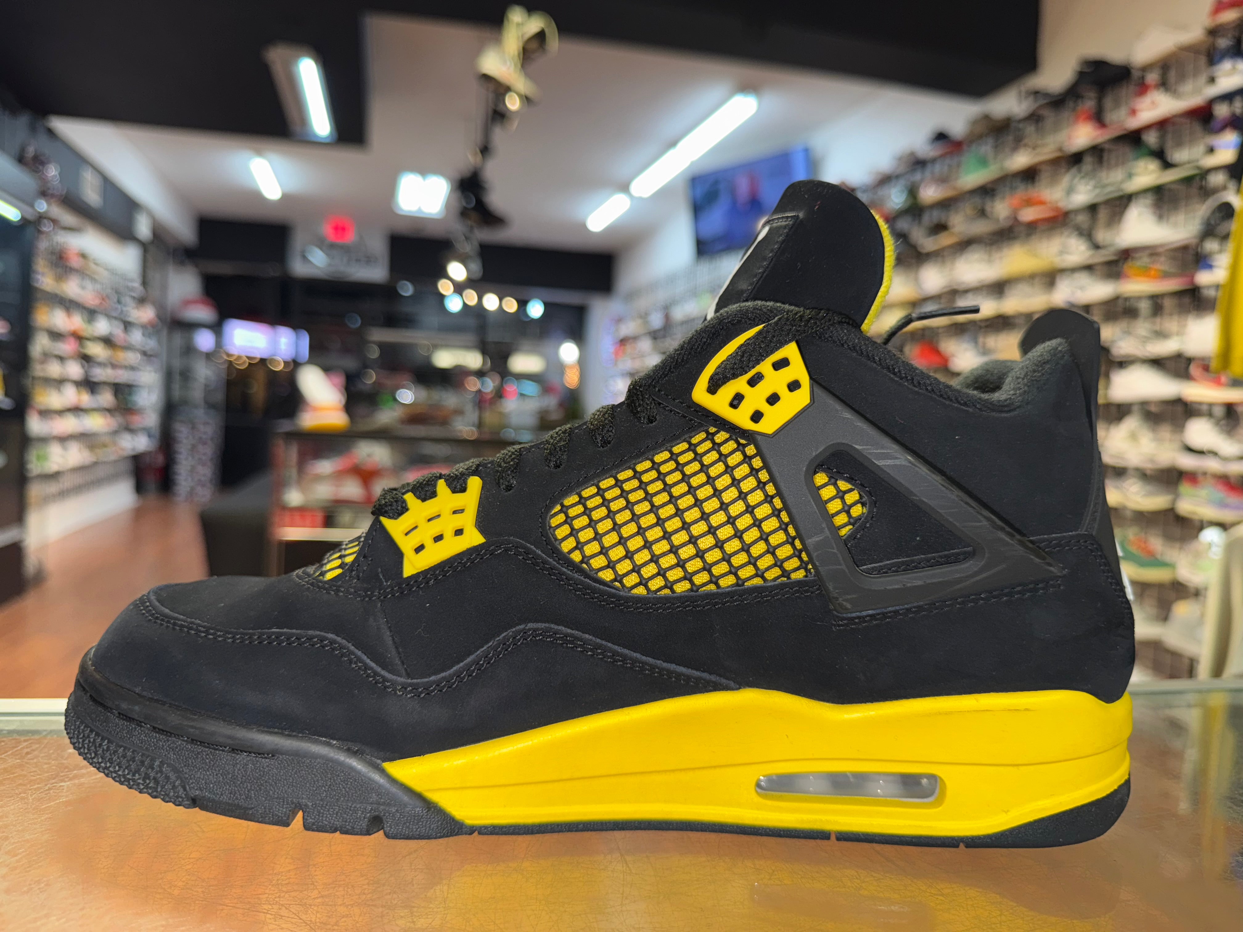 Size 11.5 Air Jordan 4 "Thunder"