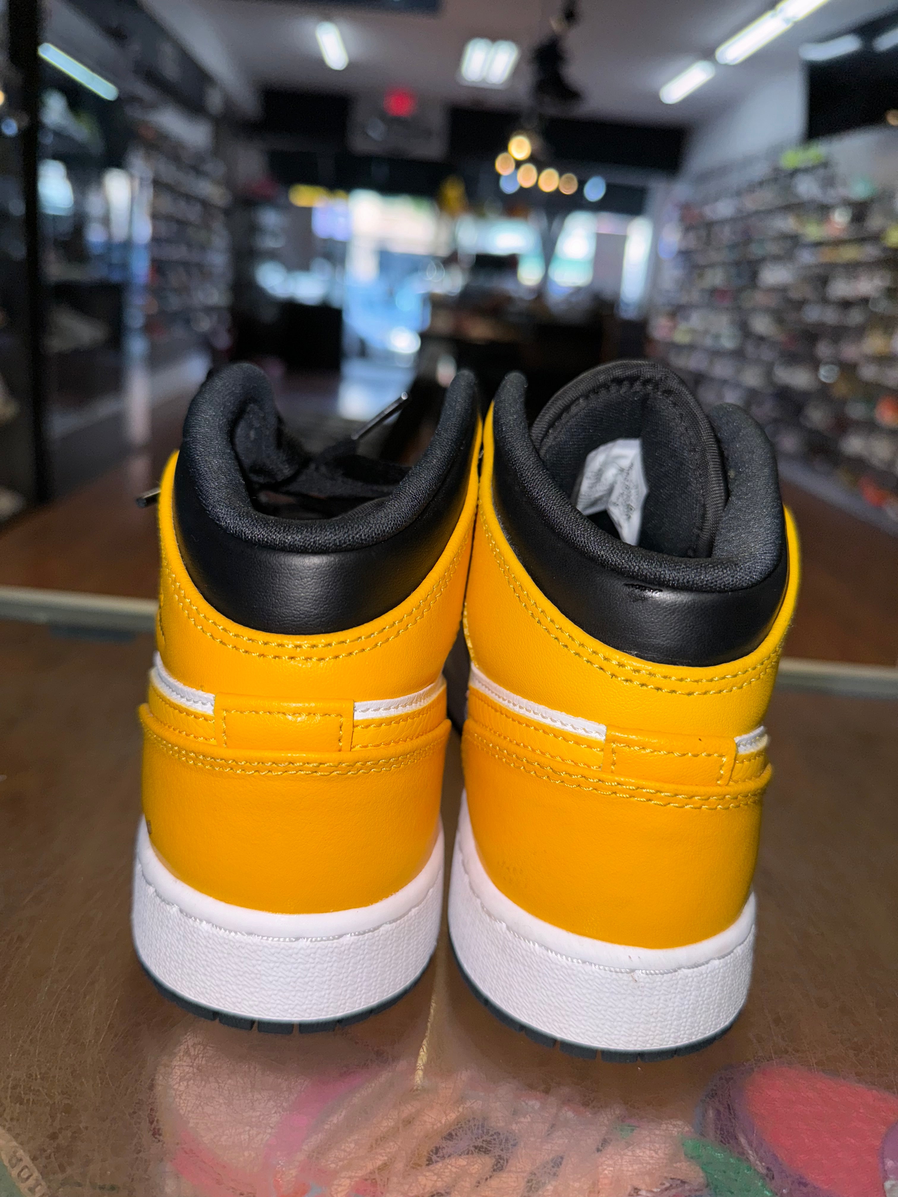 Size 4y Air Jordan 1 Mid “Yellow Toe”