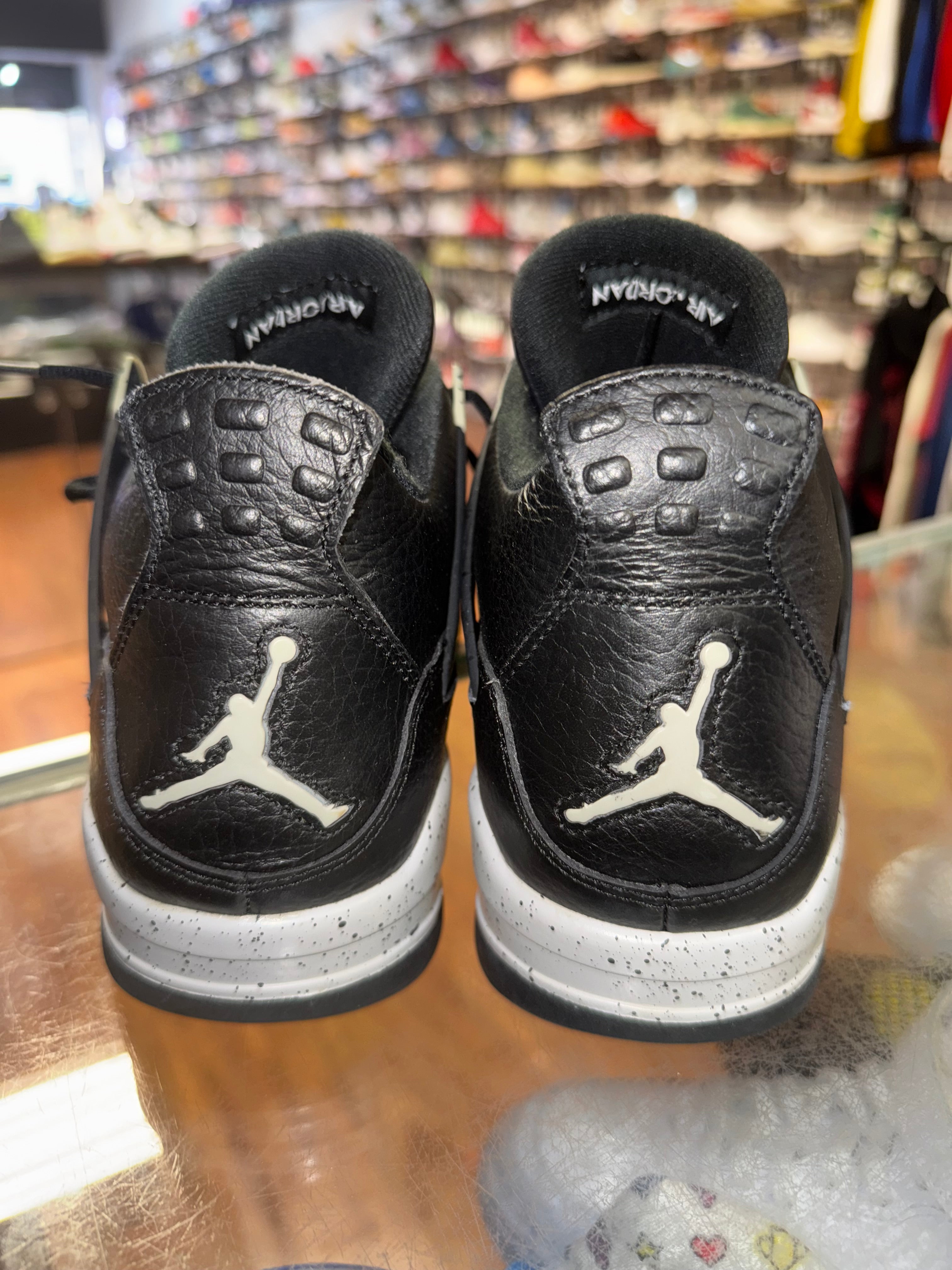 Size 9.5 Air Jordan 4 “Black Oreo”