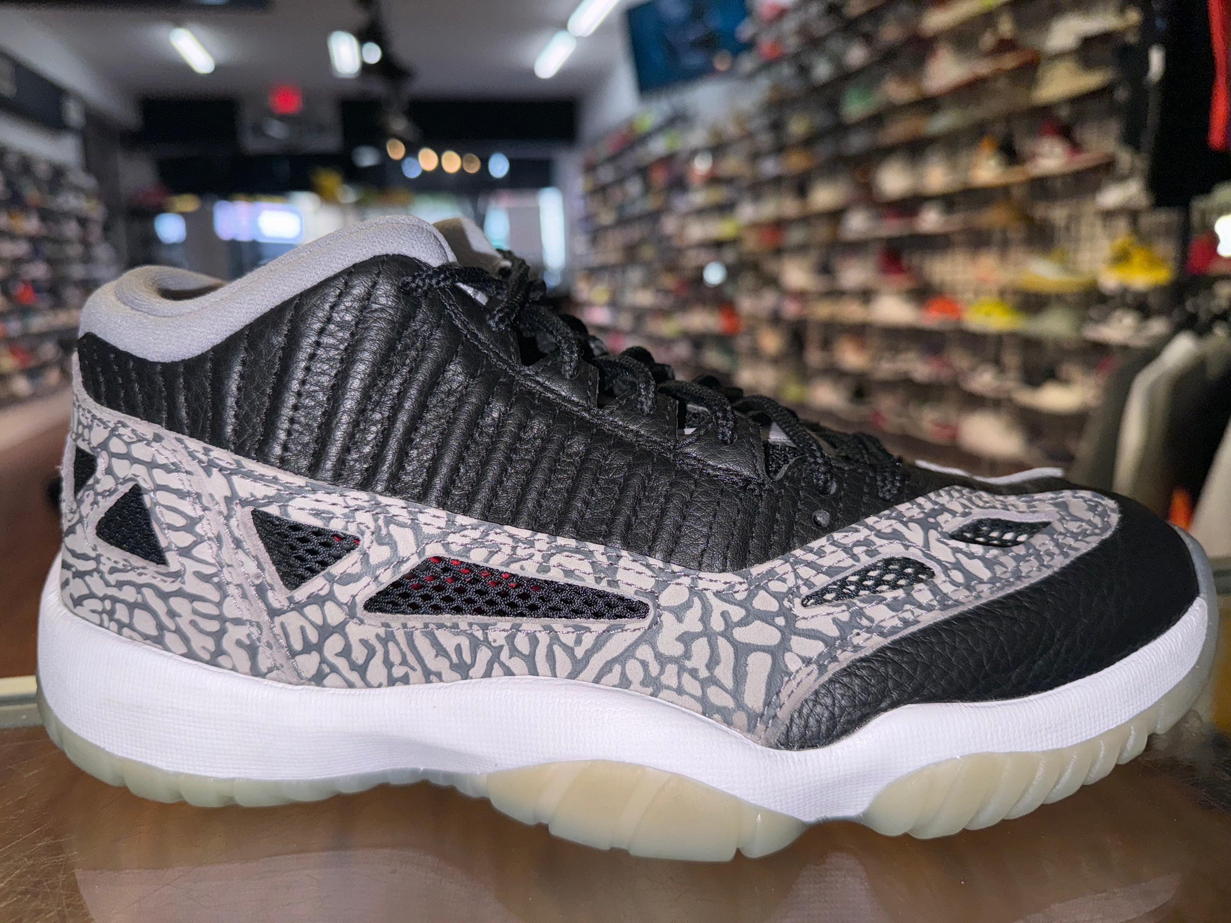 Size 8.5 Air Jordan 11 Low IE “Black Cement”