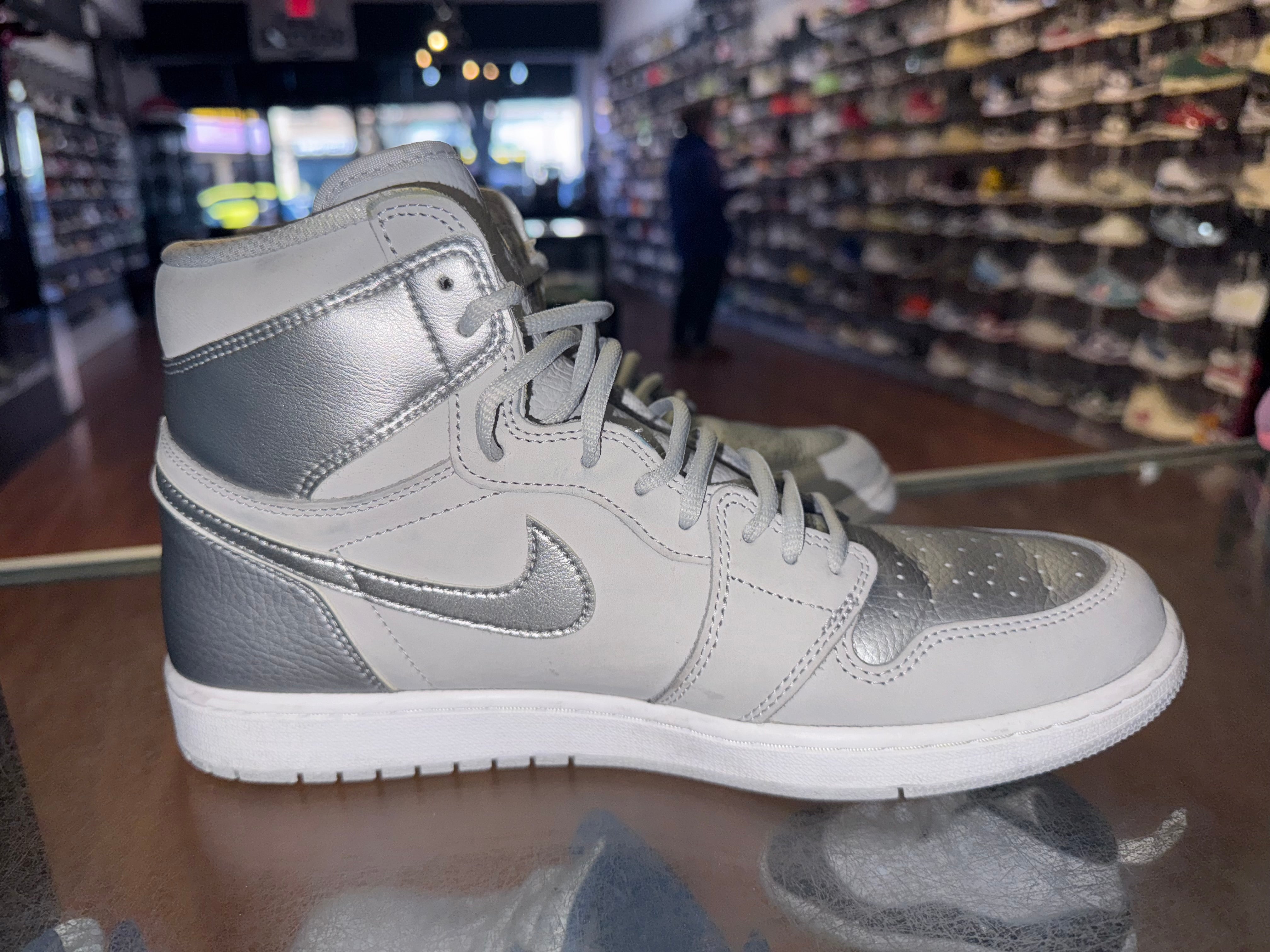 Size 11.5 Air Jordan 1 “COJP Silver”