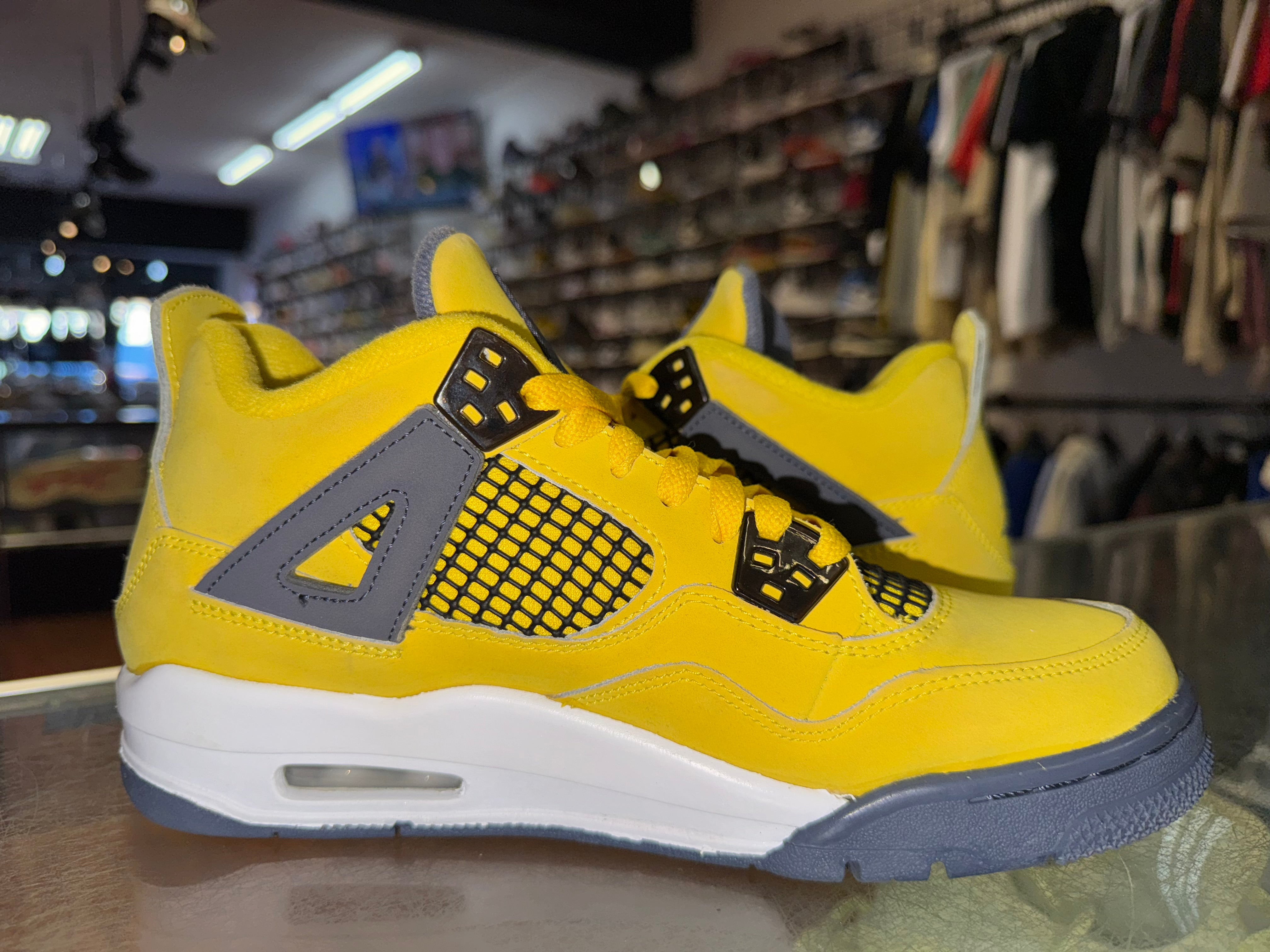 Size 7y Air Jordan 4 "Lightning"