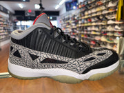 Size 10 Air Jordan 11 Low IE "Black Cement"