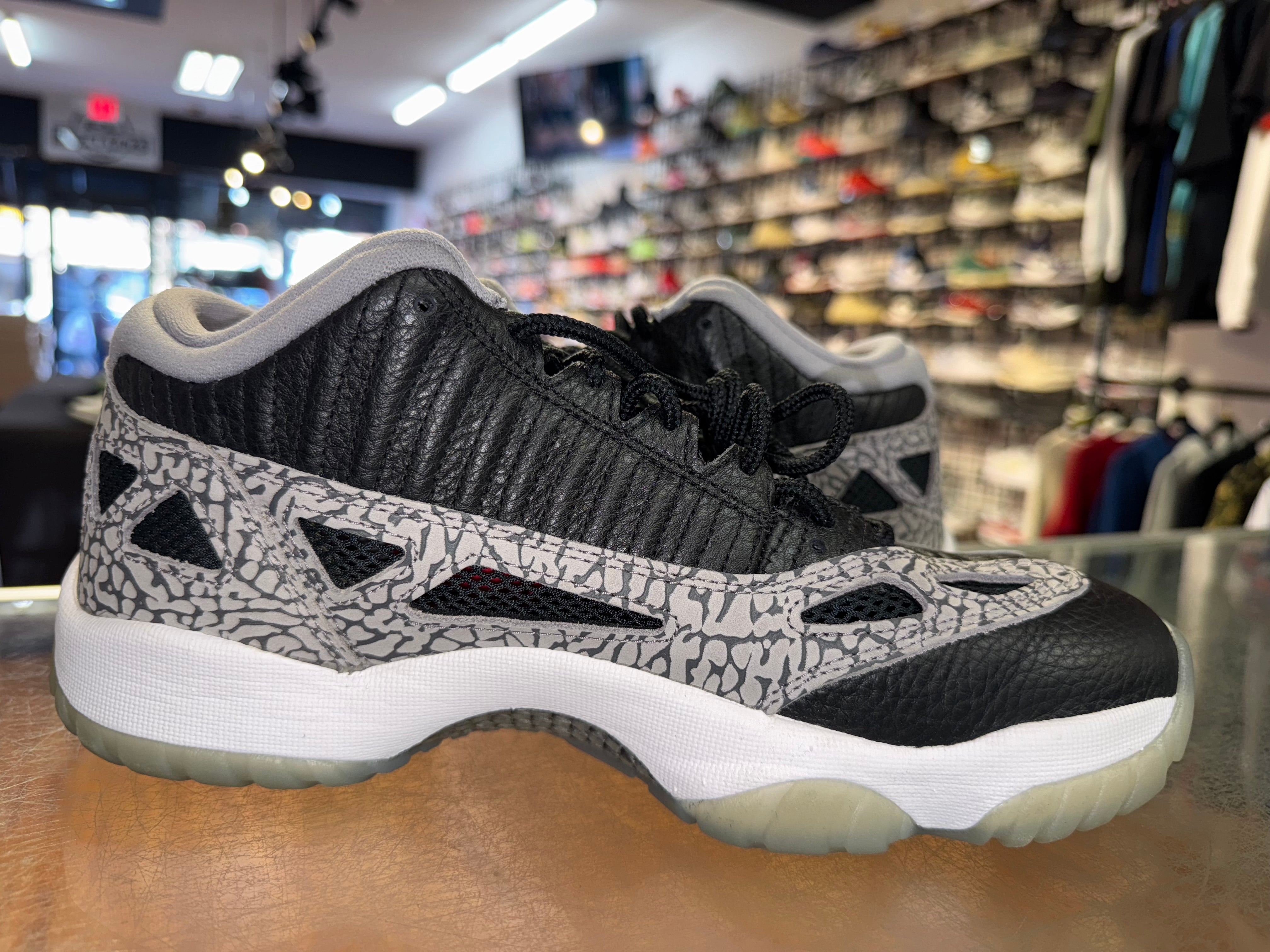 Size 8.5 Air Jordan 11 Low IE "Black Cement"