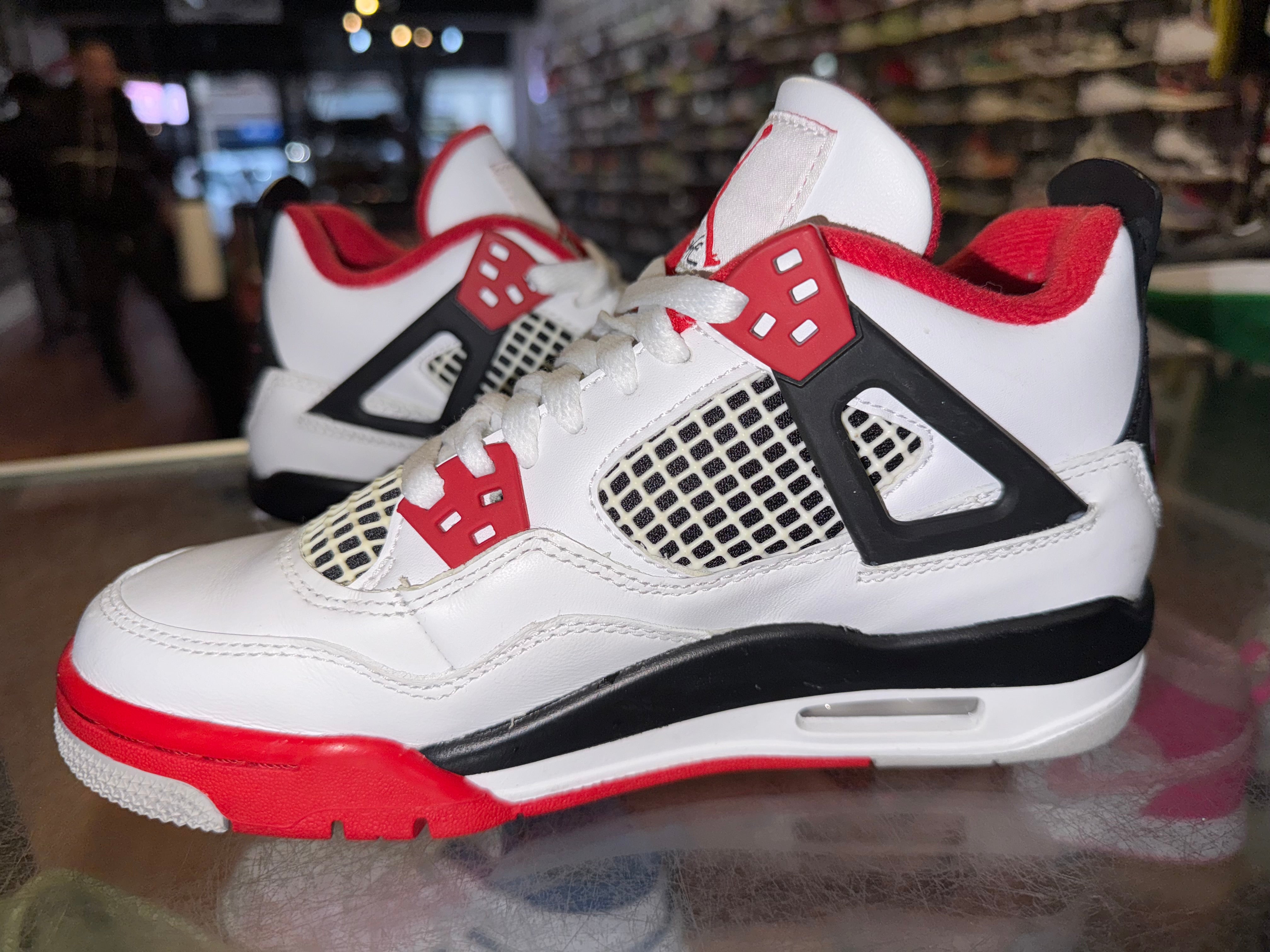 Size 4y Air Jordan 4 “Fire Red”