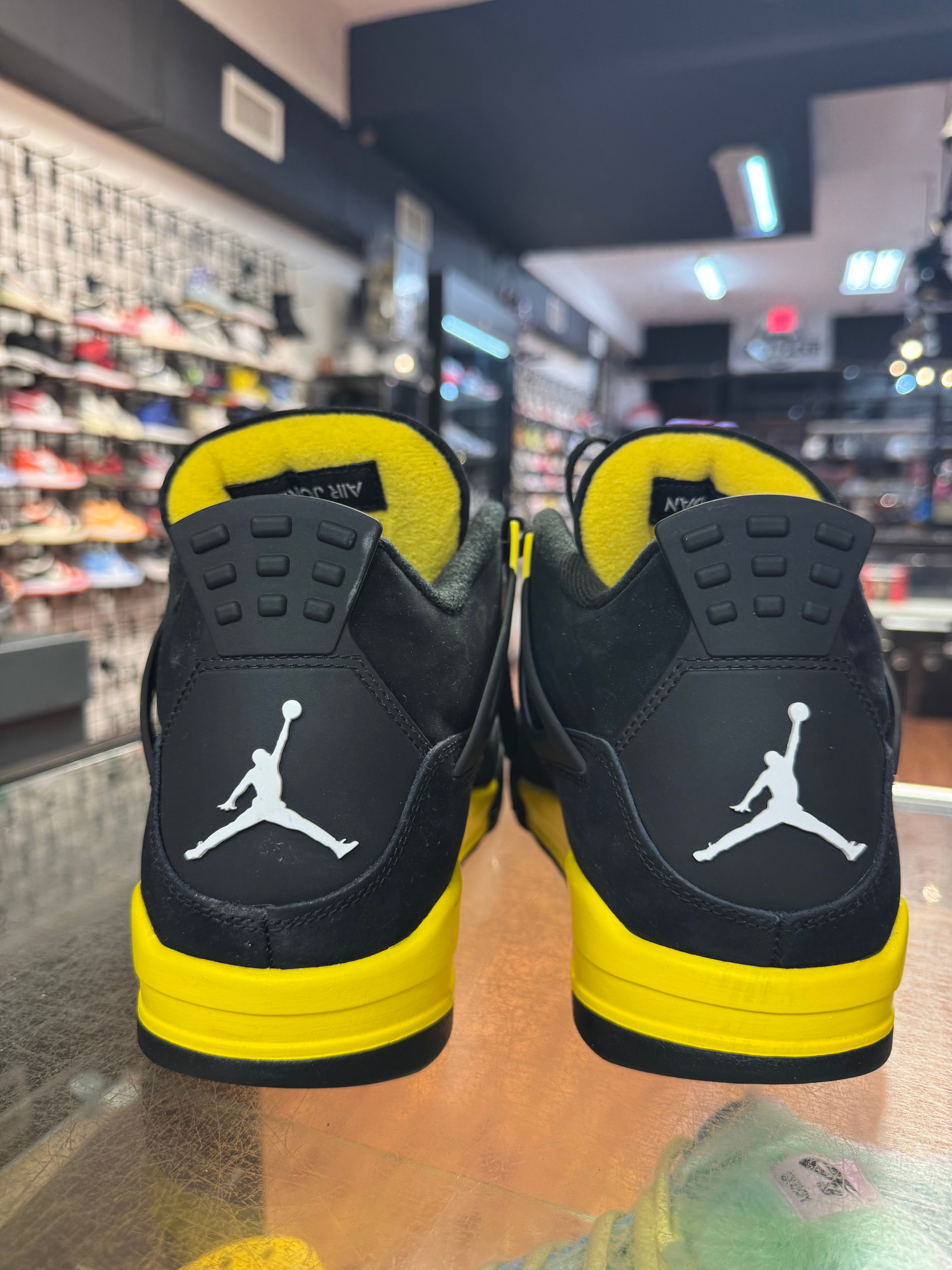 Size 11.5 Air Jordan 4 “Thunder”