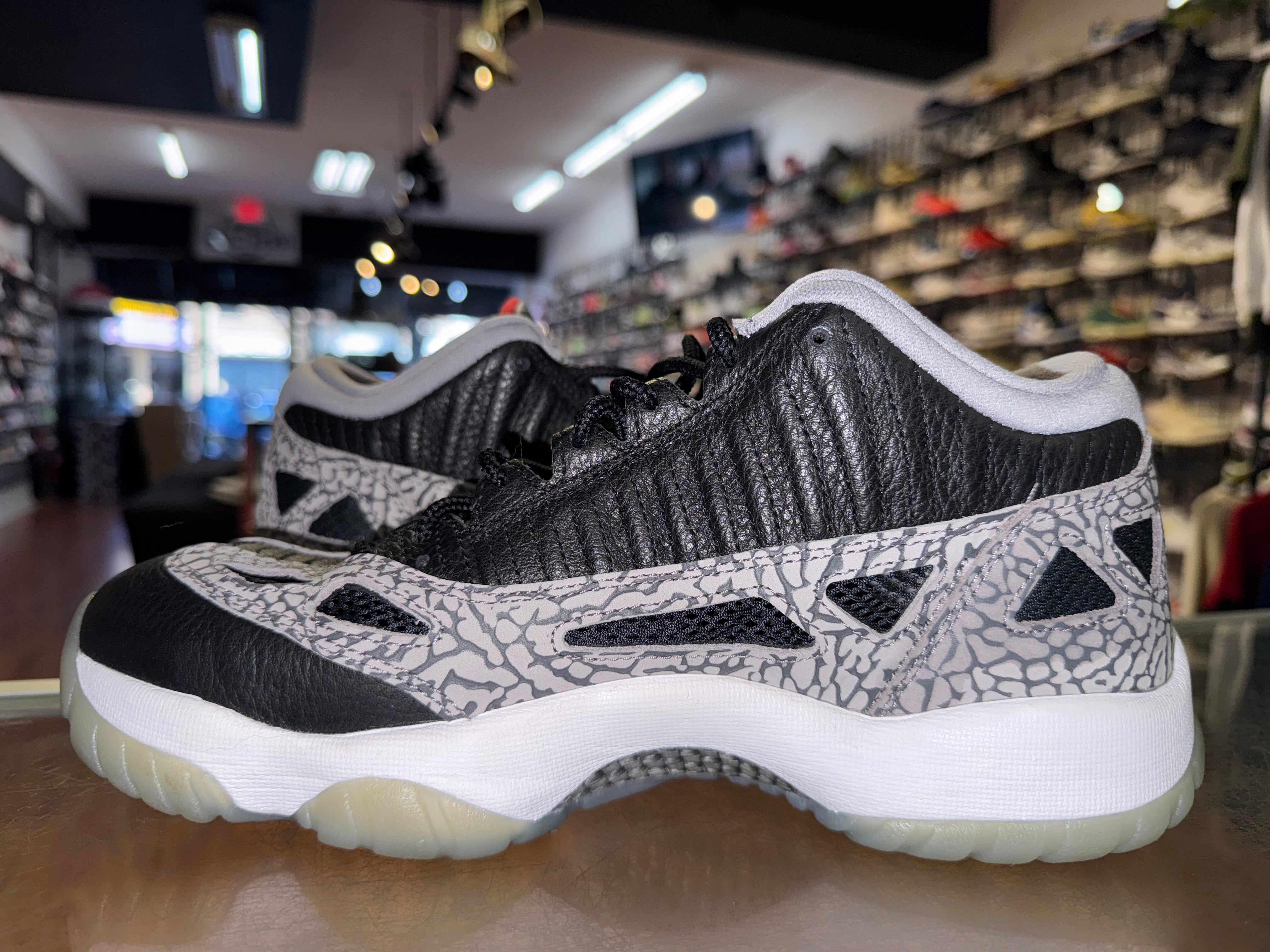 Size 8.5 Air Jordan 11 Low IE "Black Cement"