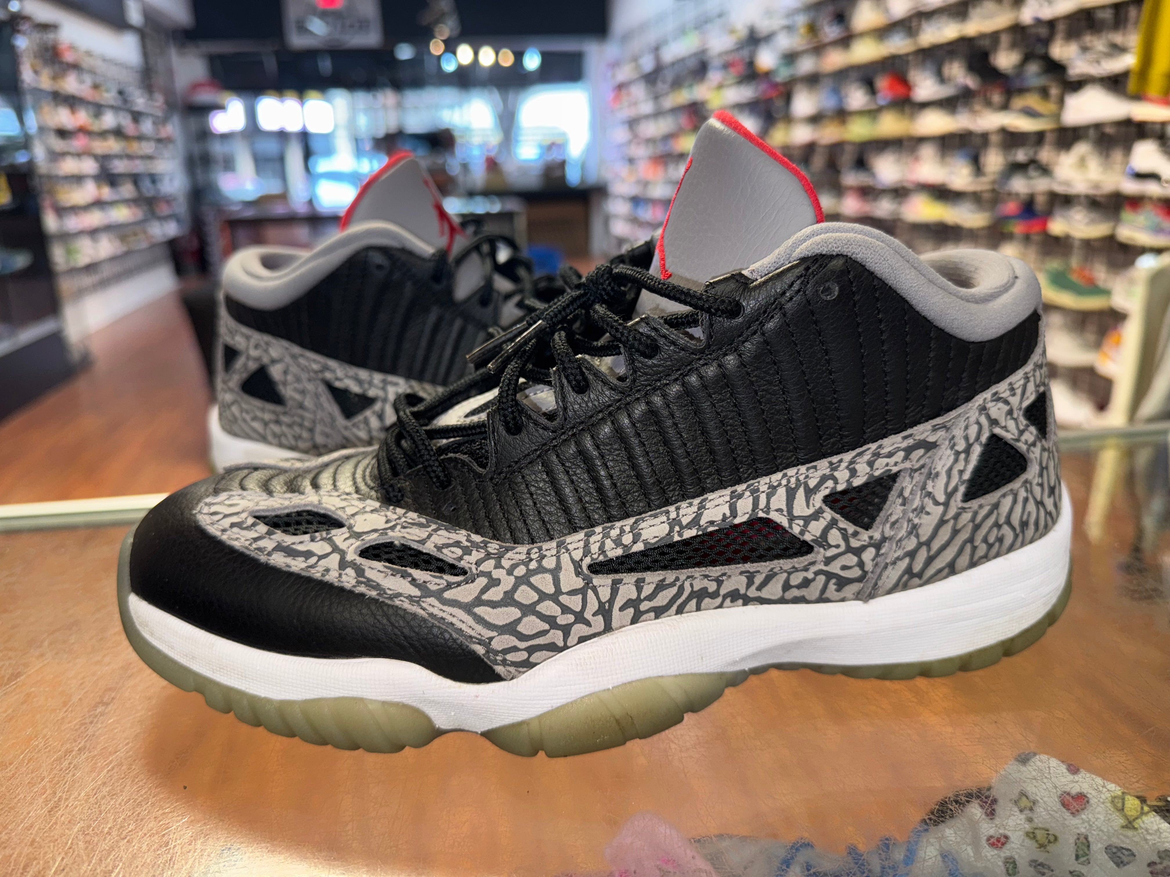 Size 10 Air Jordan 11 Low IE "Black Cement"