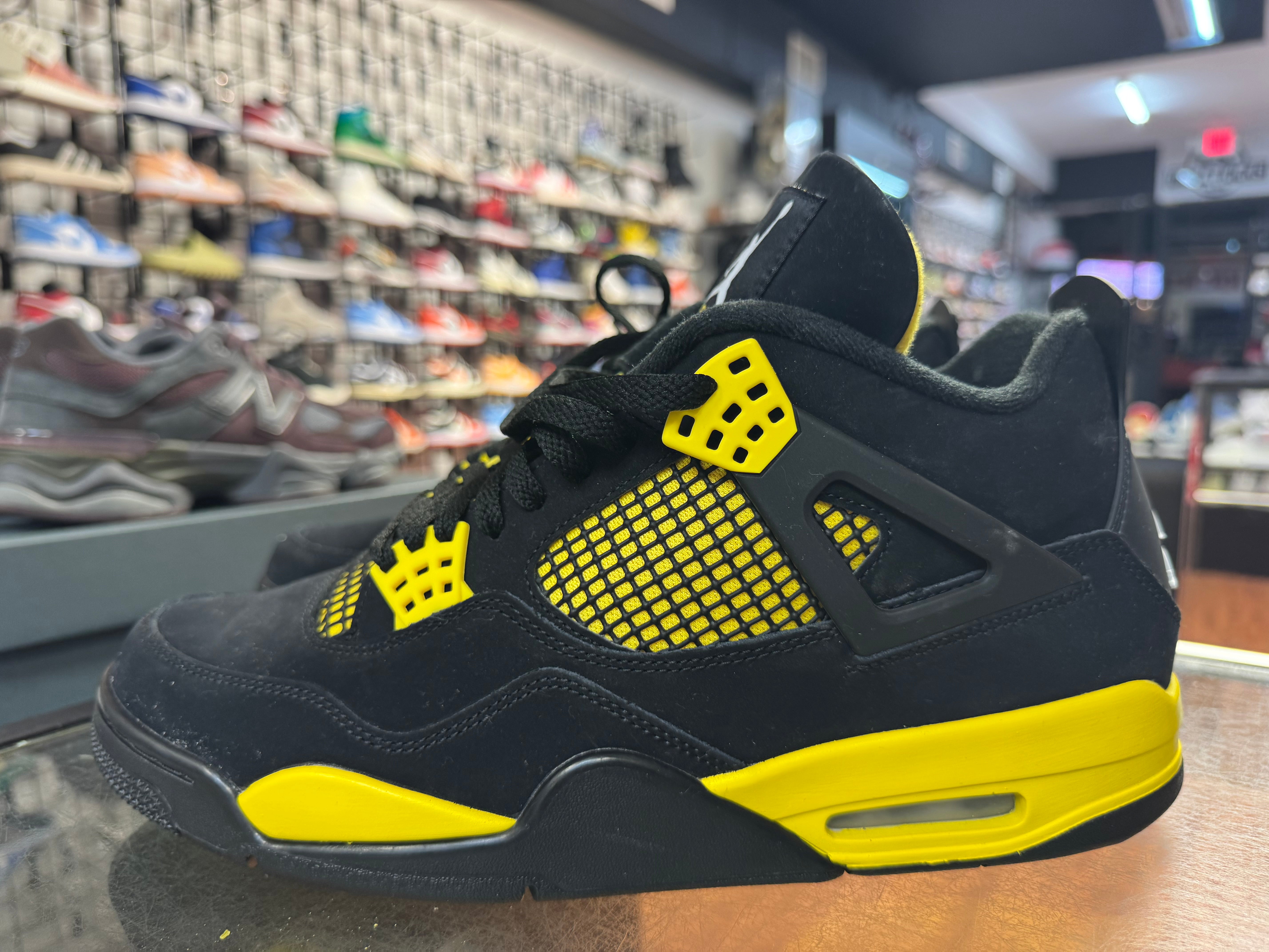 Size 11.5 Air Jordan 4 “Thunder”