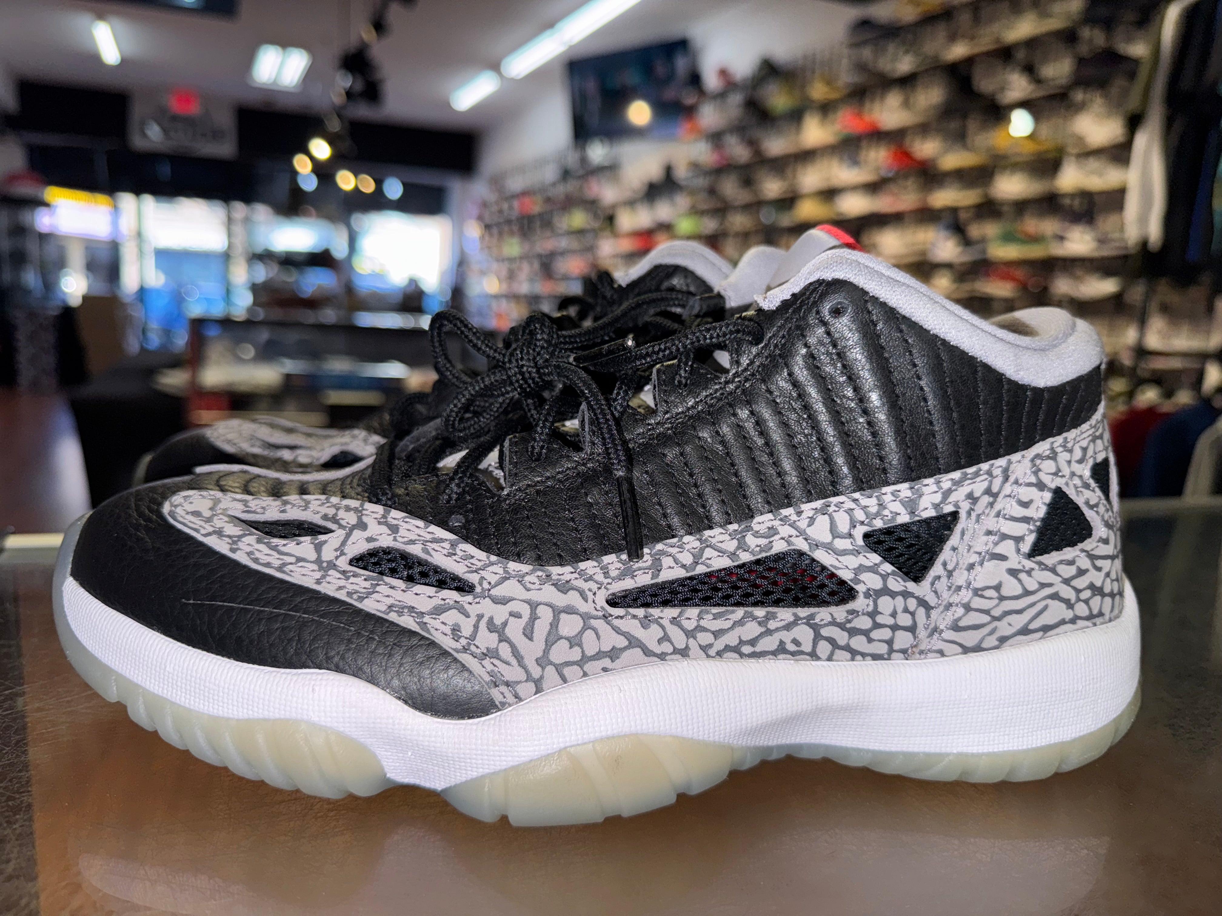 Size 8.5 Air Jordan 11 Low IE "Black Cement"