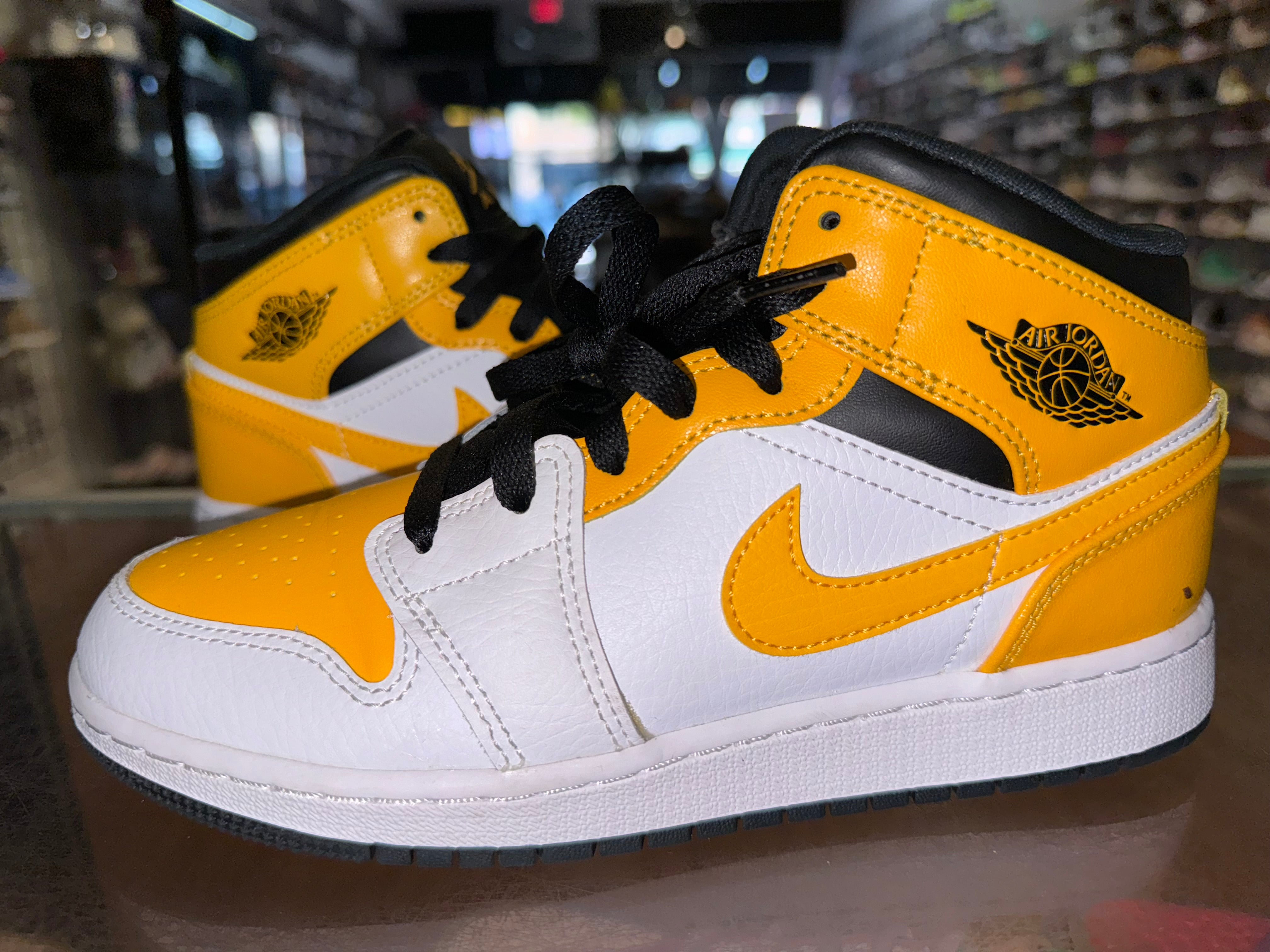 Size 4y Air Jordan 1 Mid “Yellow Toe”