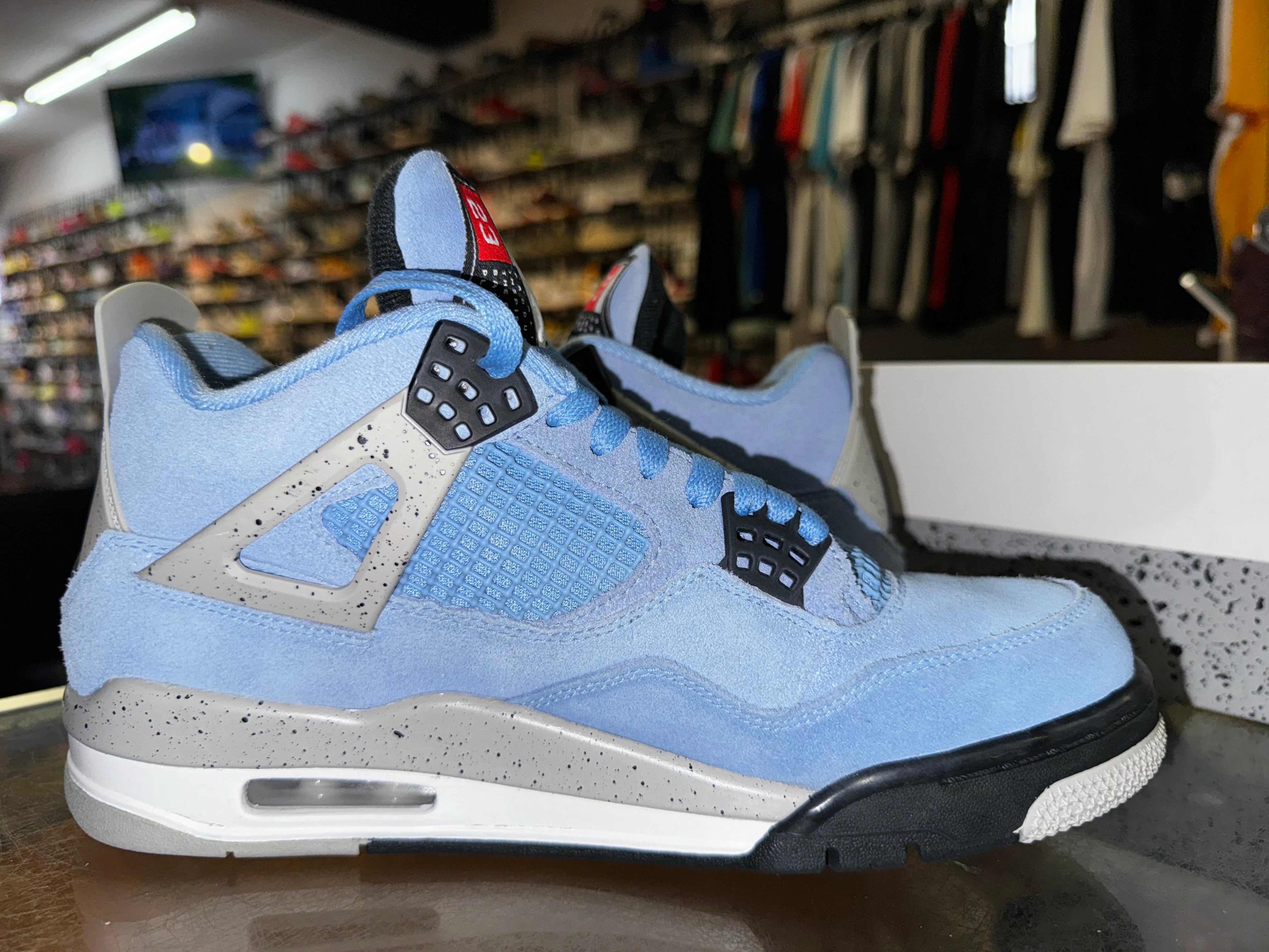 Size 9 Air Jordan 4 "UNC"