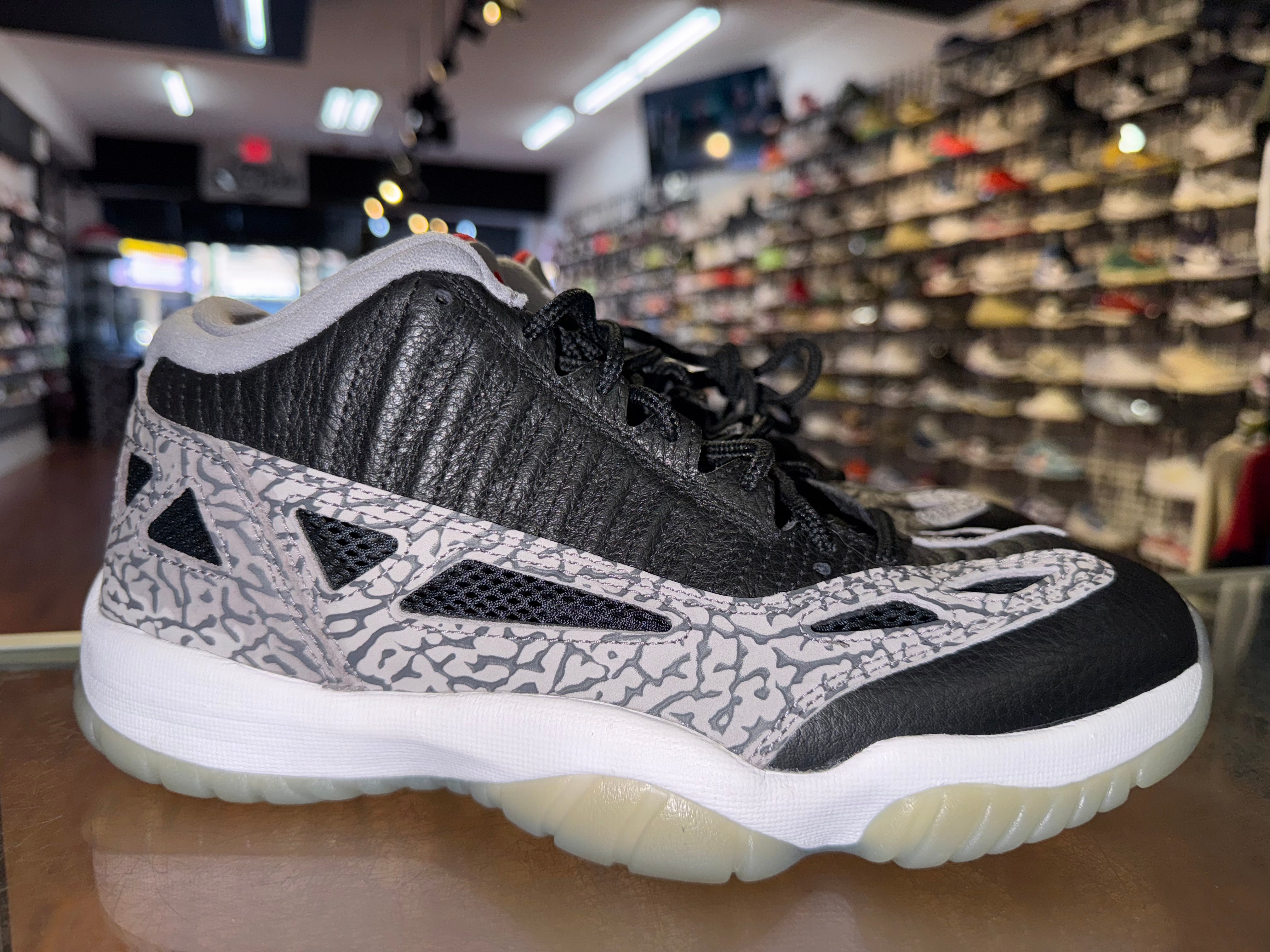 Size 8.5 Air Jordan 11 Low IE "Black Cement"