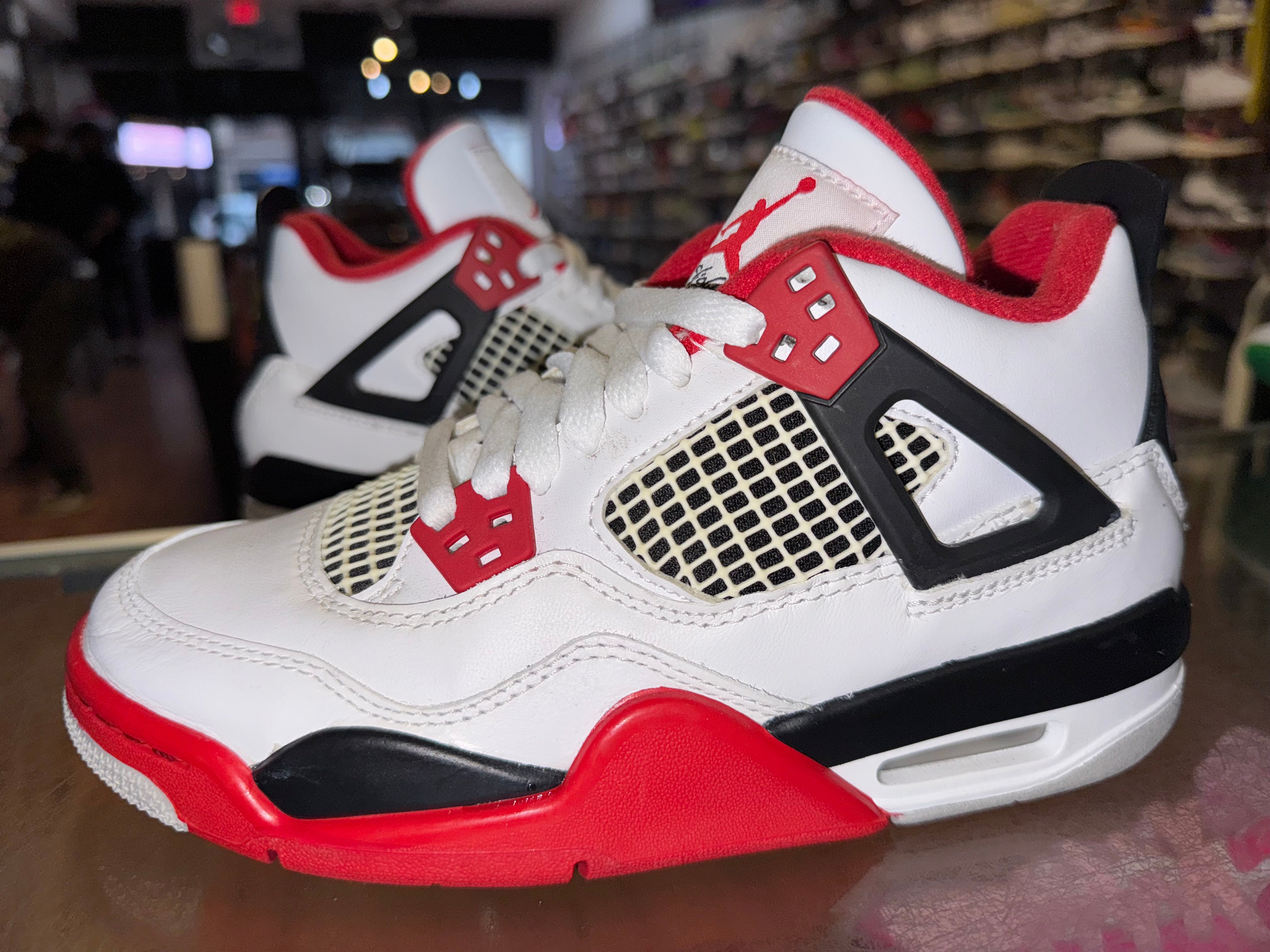 Size 4y Air Jordan 4 “Fire Red”