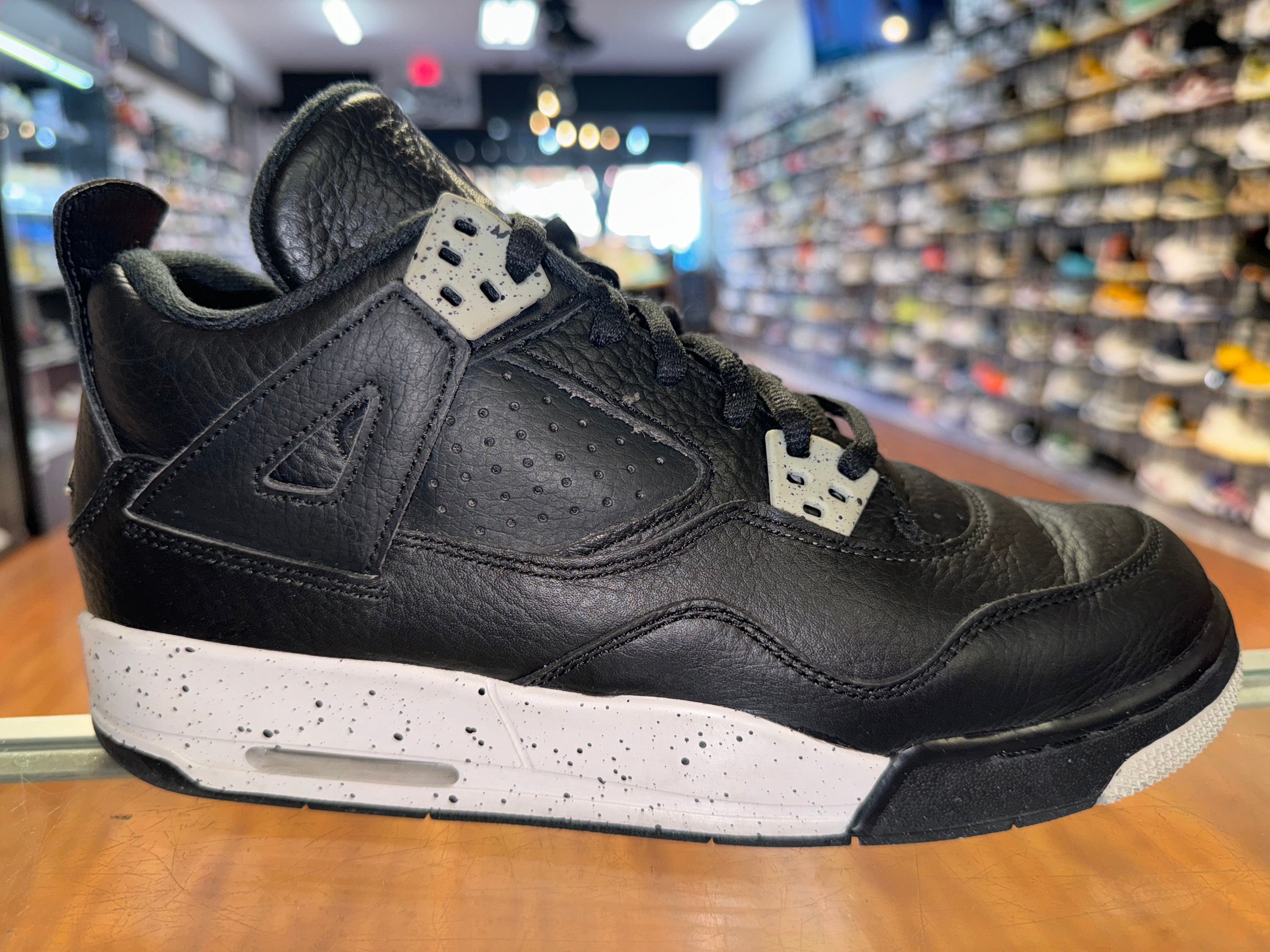 Size 6.5y Air Jordan 4 “Black Oreo”