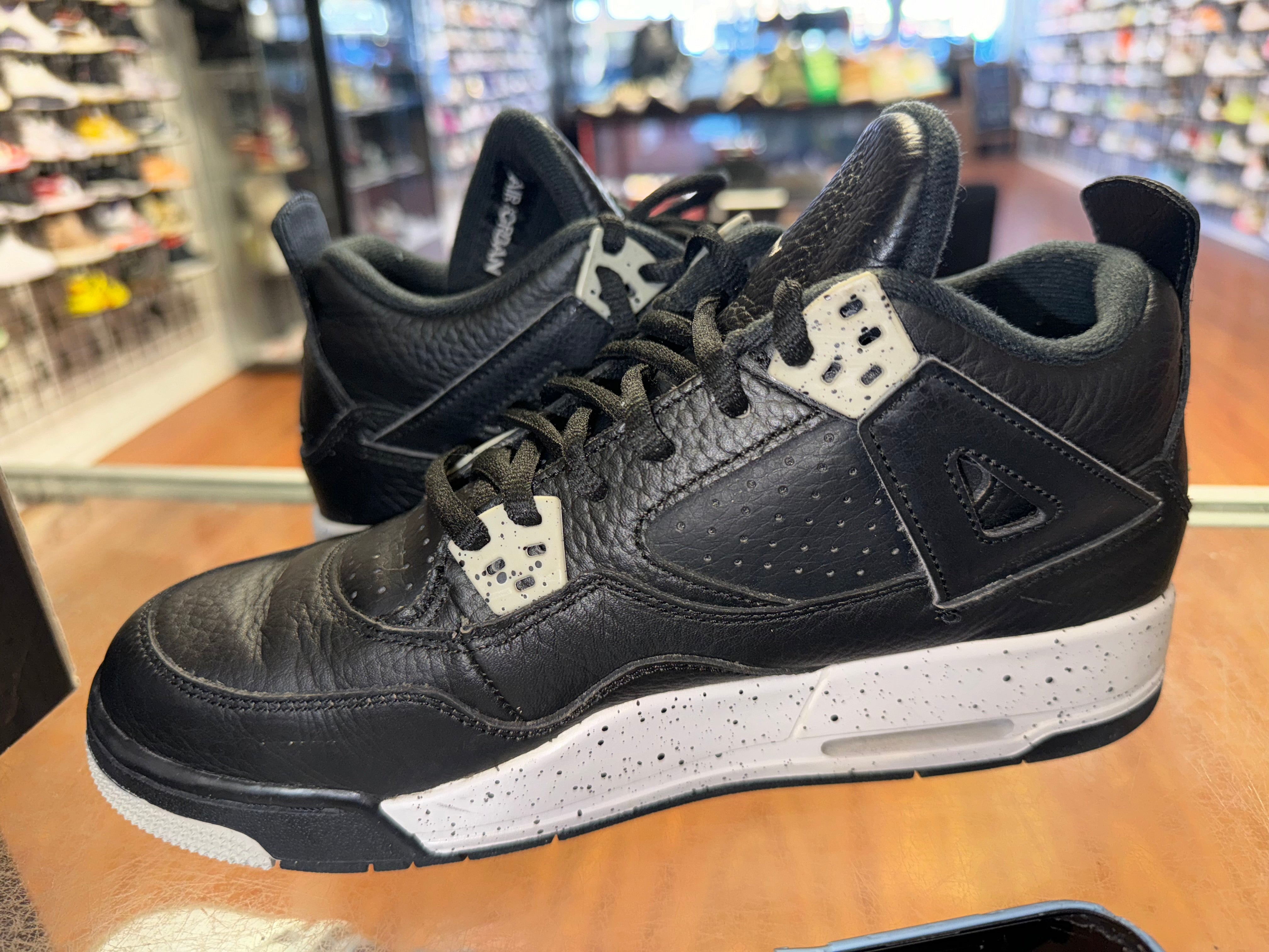 Size 6.5y Air Jordan 4 “Black Oreo”