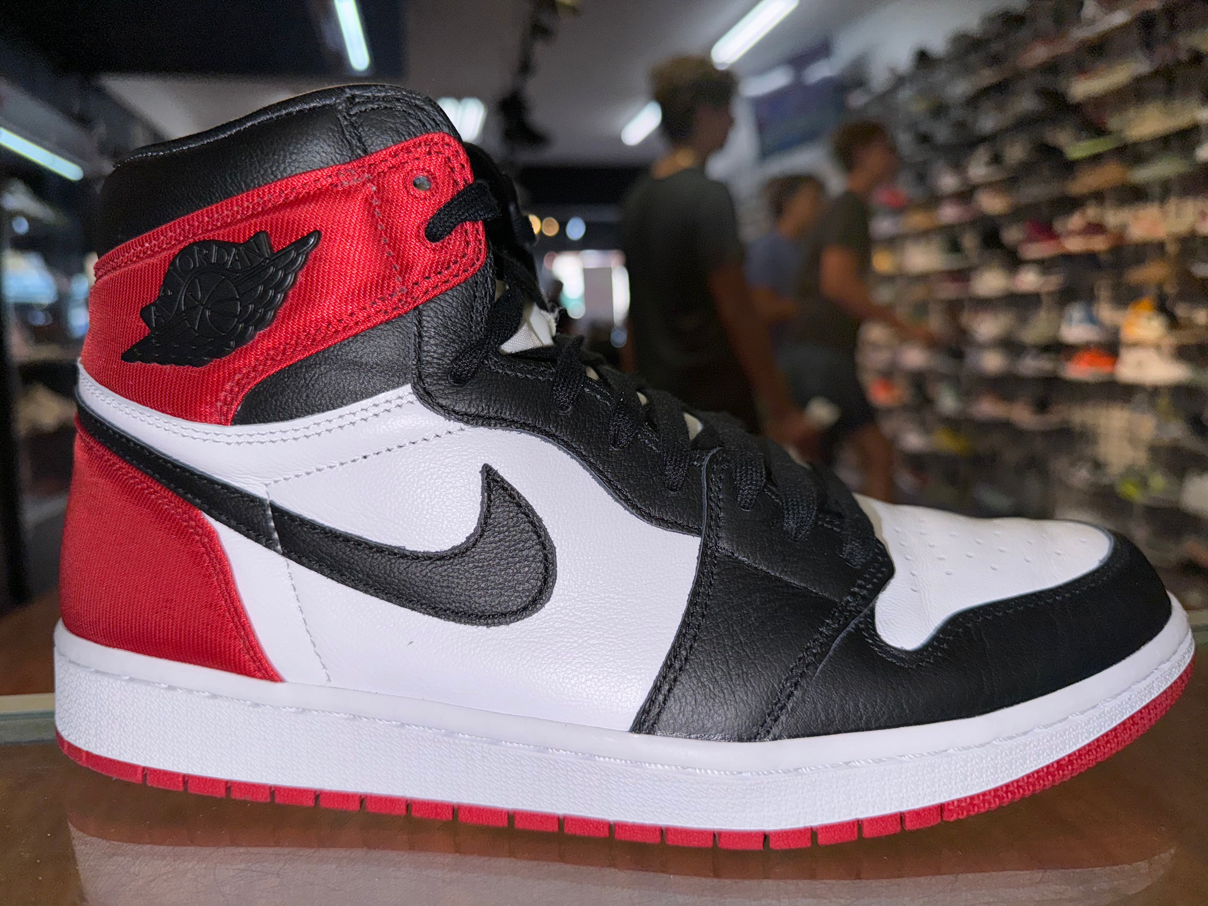 Size 9.5 (11W) Air Jordan 1 “Satin Black Toe”